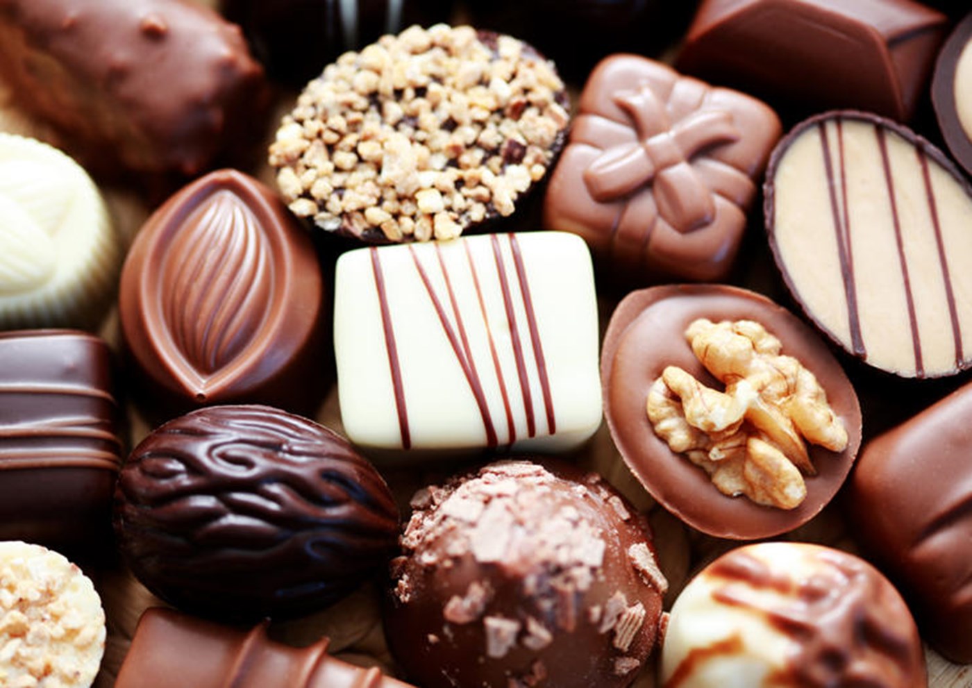 A close up of a selection of chocolate truffles. 