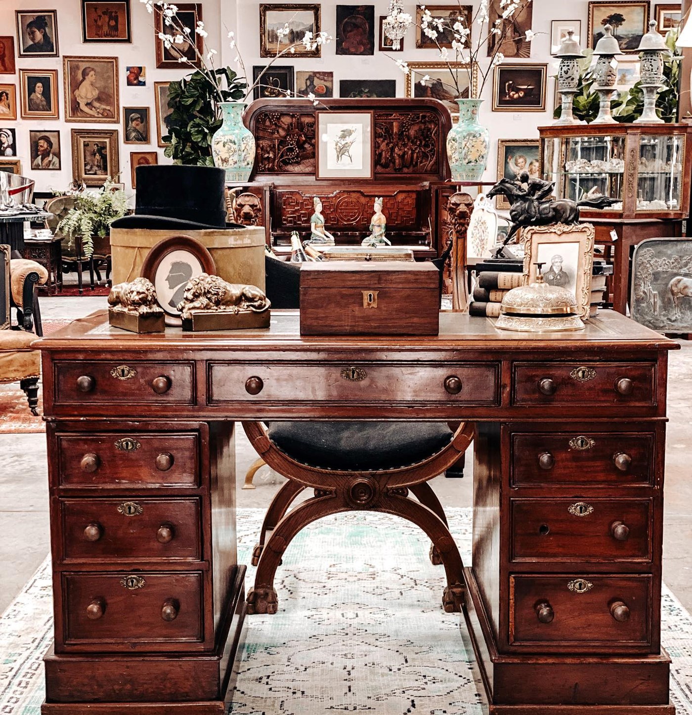 An antique desk stacked with other goodies at The Powderworks Warehouse in Sydney 