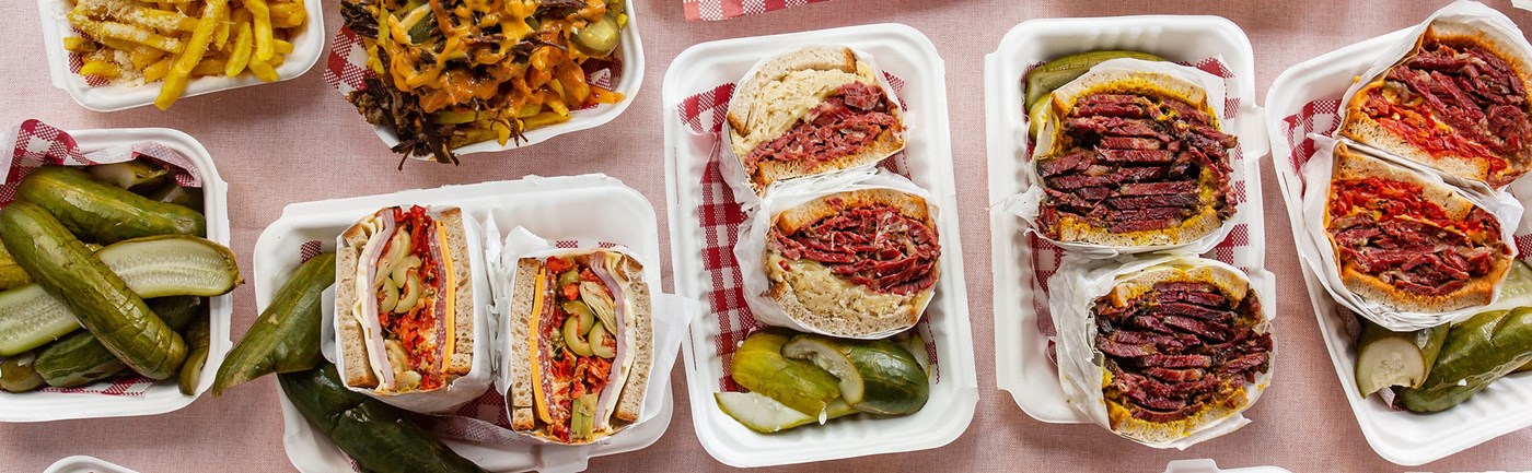 top view of 3 pastrami sandwiches on white takeaway box from Lenny Briskets Darlinghurst Sydney
