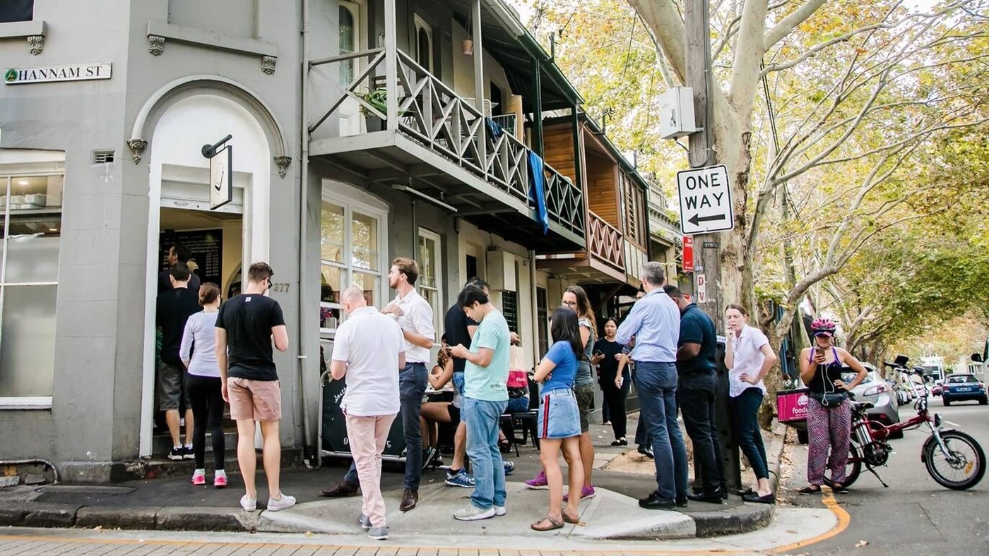 Exterior of South Dowling Cafe Darlinghurst Sydney with a long line of patrons outside