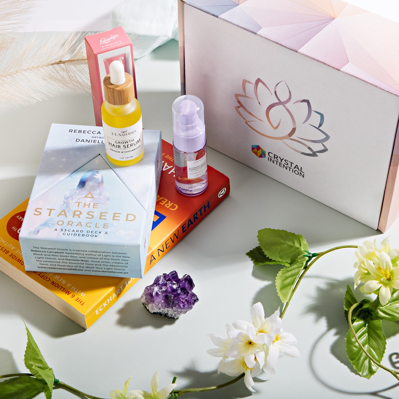  A Crystal Intention gift box, featuring crystals, hair serum, a book and guiding cards. 
