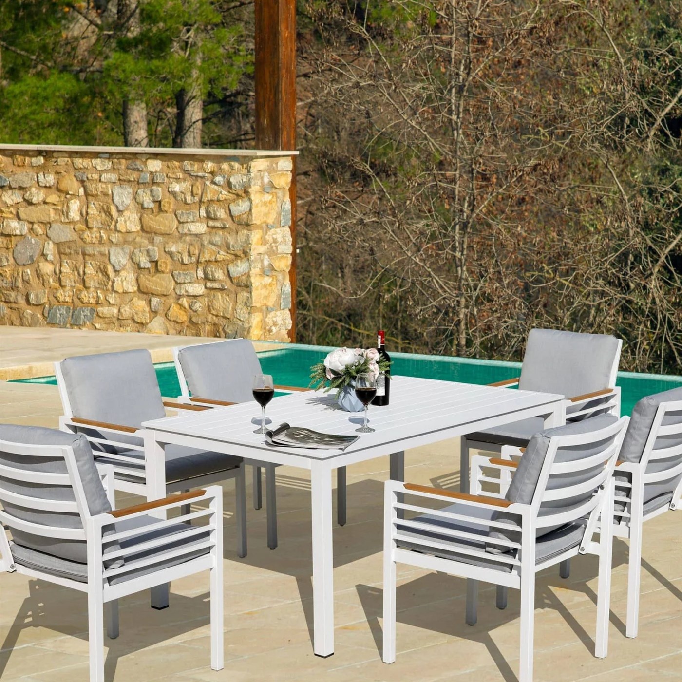Olan Living Outdoor Furniture table and chairs next to plunge pool