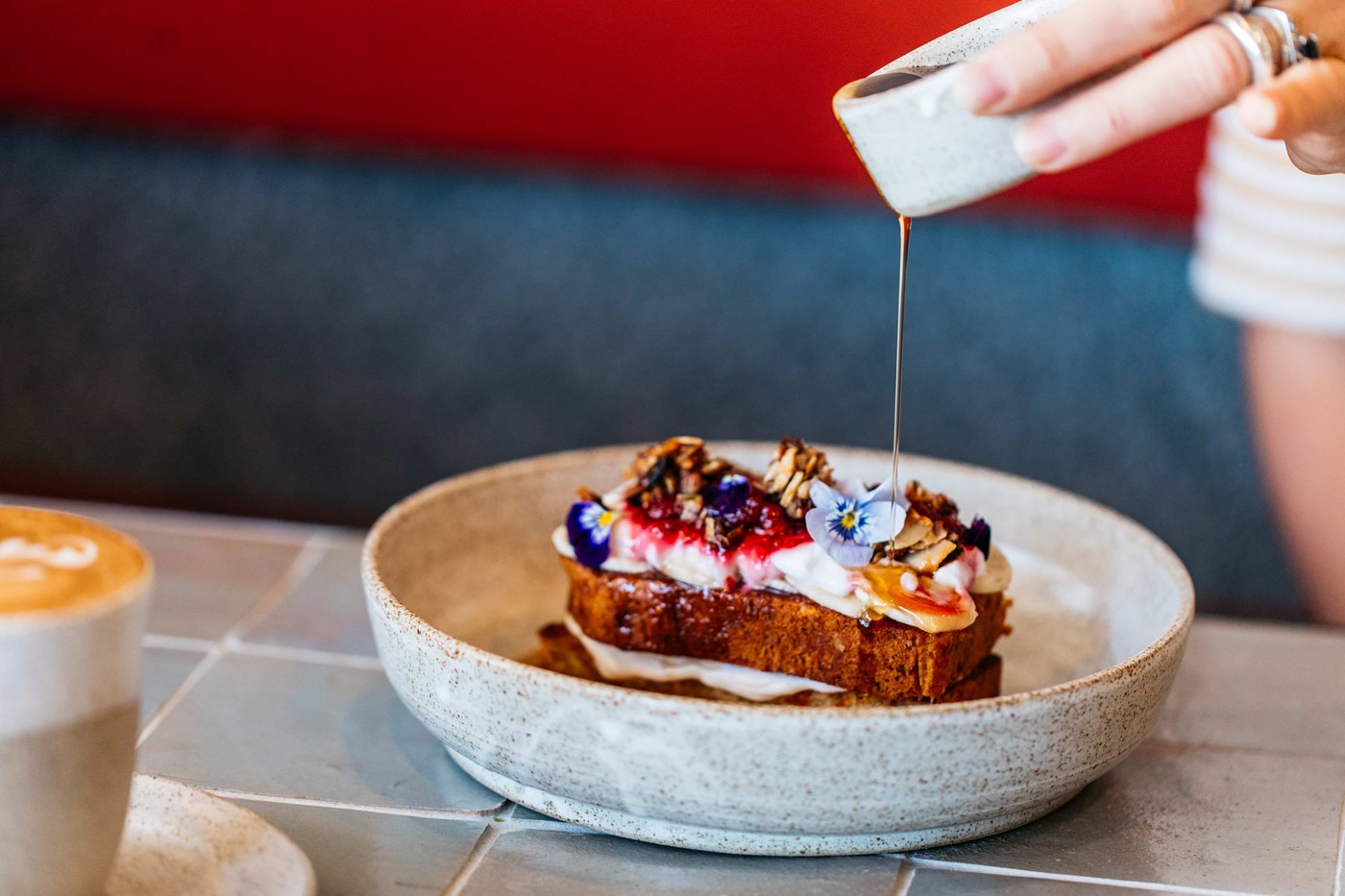 Best Cafes in Bondi: Maple syrup poured over French Toast at Porch and Parlour Bondi Beach