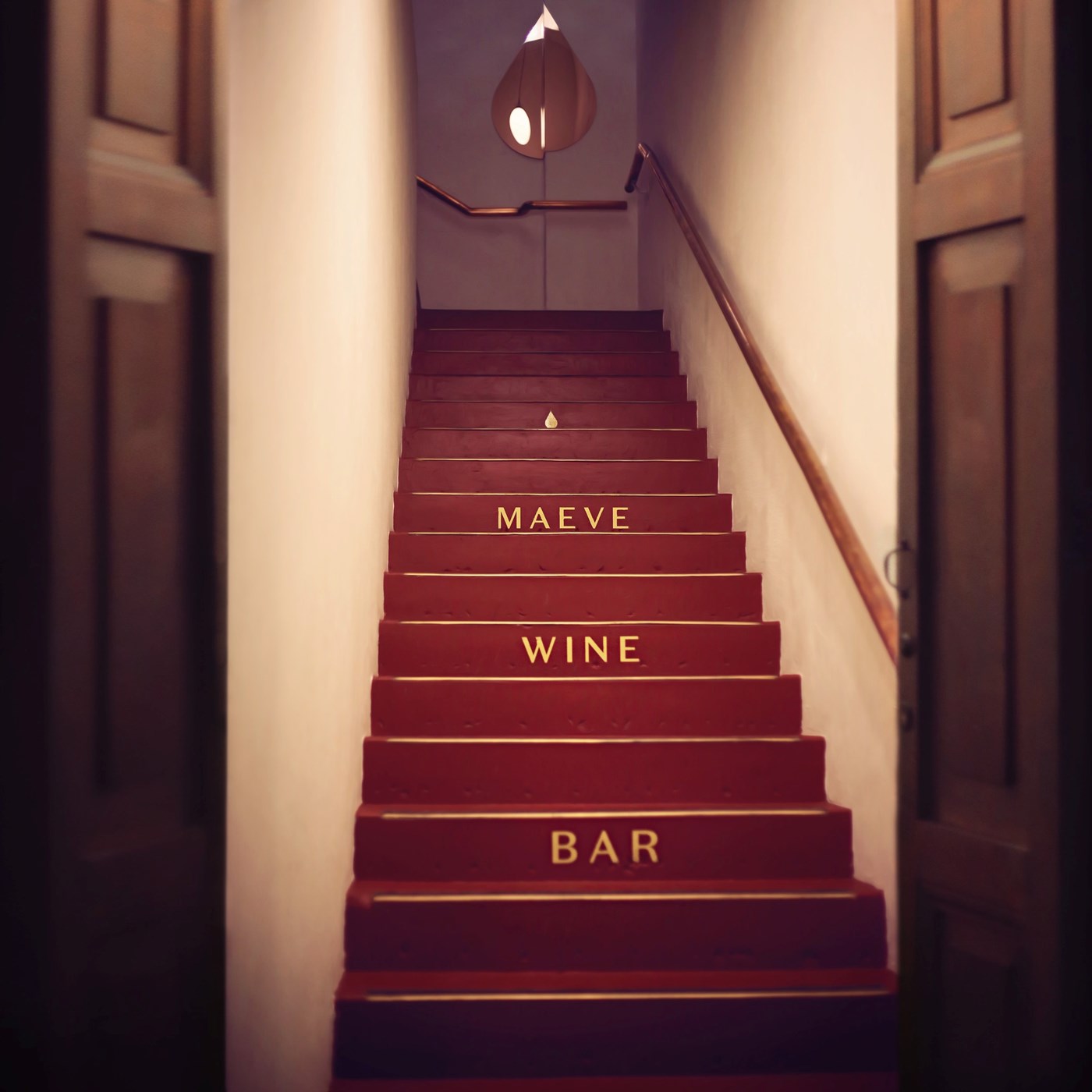 The staircase entrance at Maeve Wine Bar in Brisbane