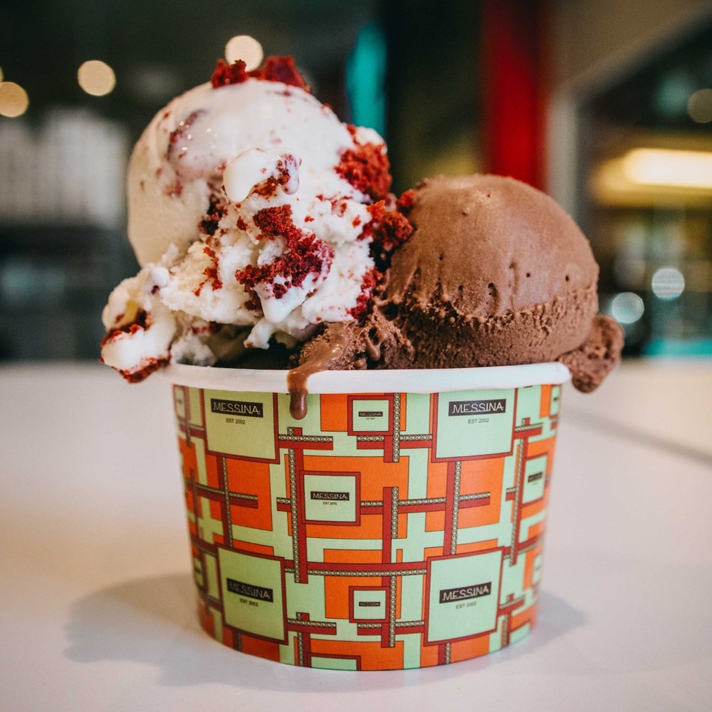 Red velvet and chocolate gelato in a cup. 
