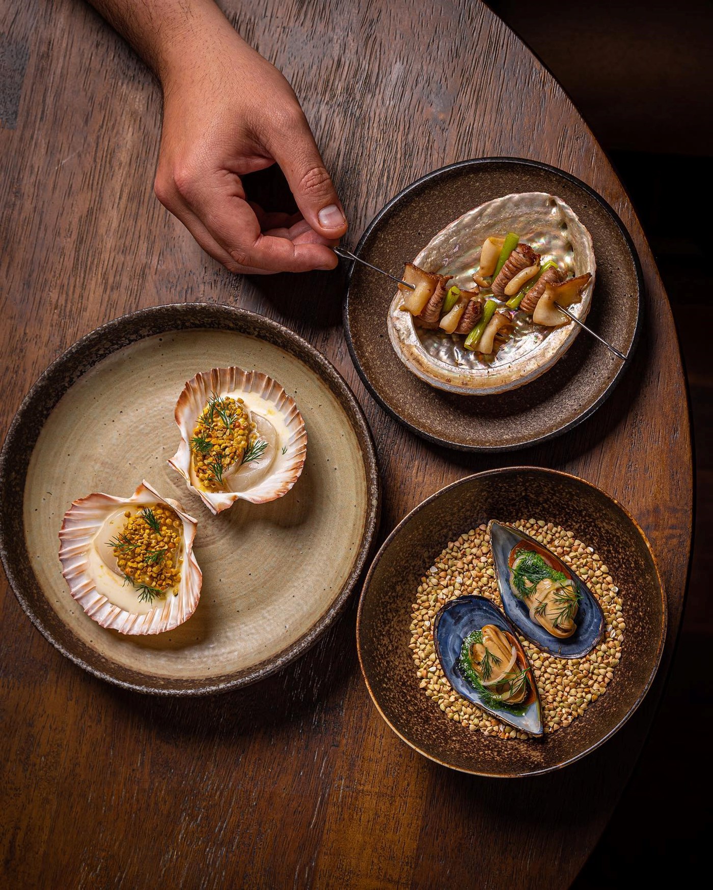Best Fine Dining Canberra: Three minimalist dishes including scallops, mussels and skewers at Otis in Canberra. 