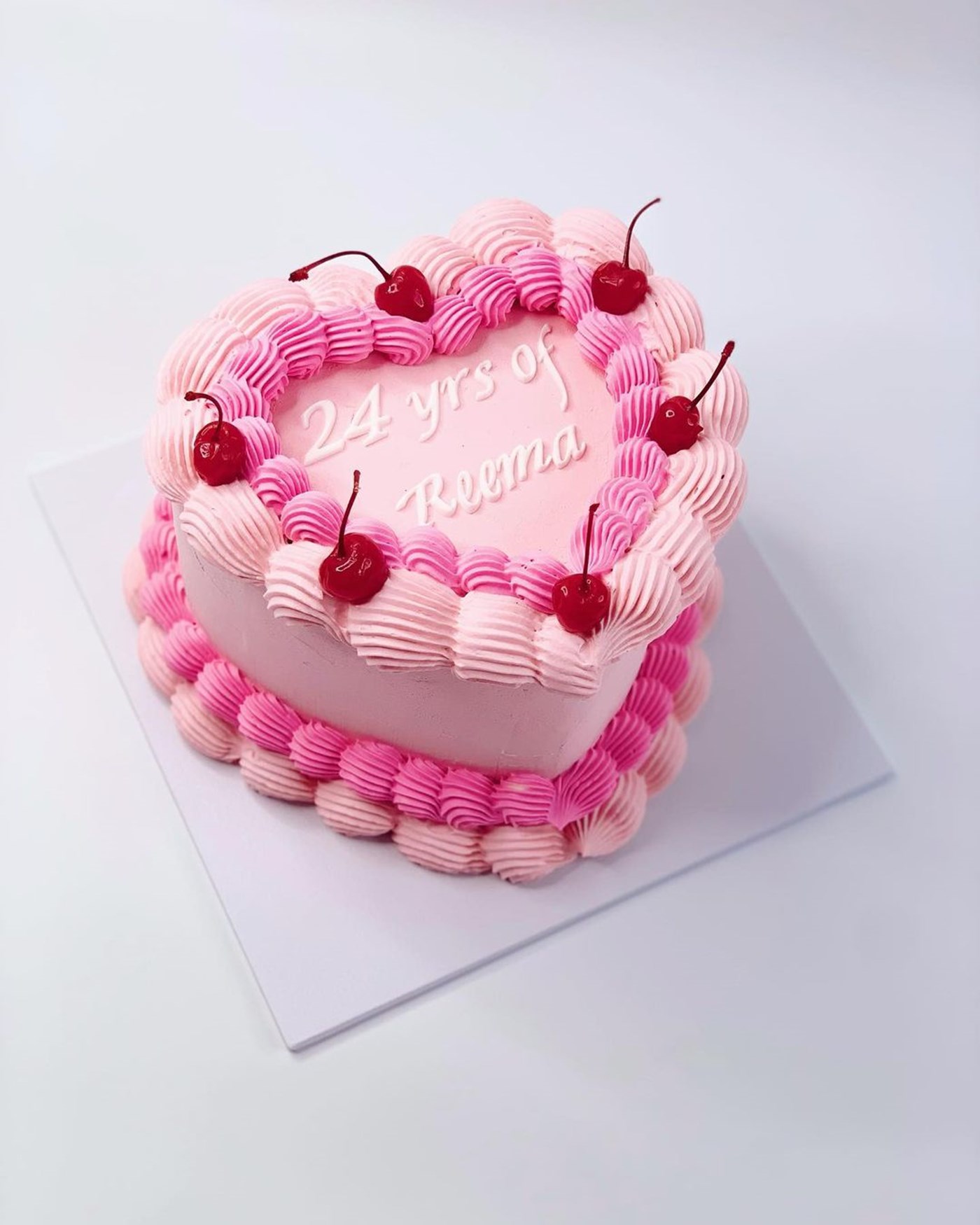 Best Cake Shops Canberra: A love heart cake with piped icing and decorated with cherries in the Marie Antionette style 