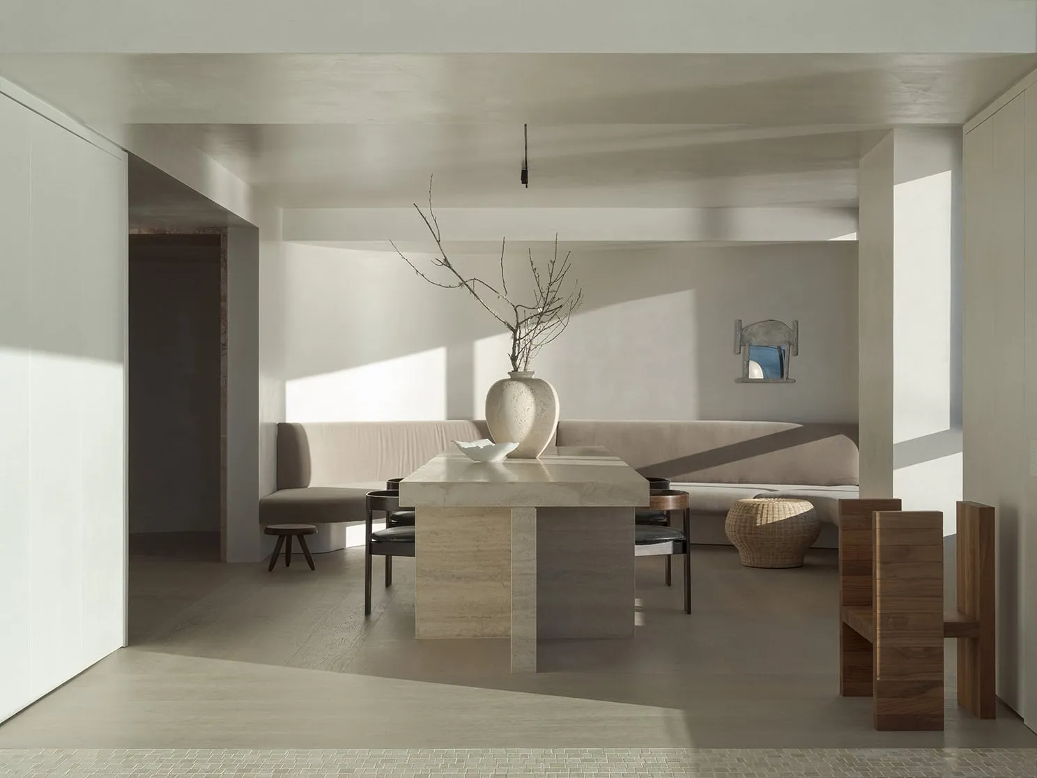 A modern dining room with a wooden table and chairs