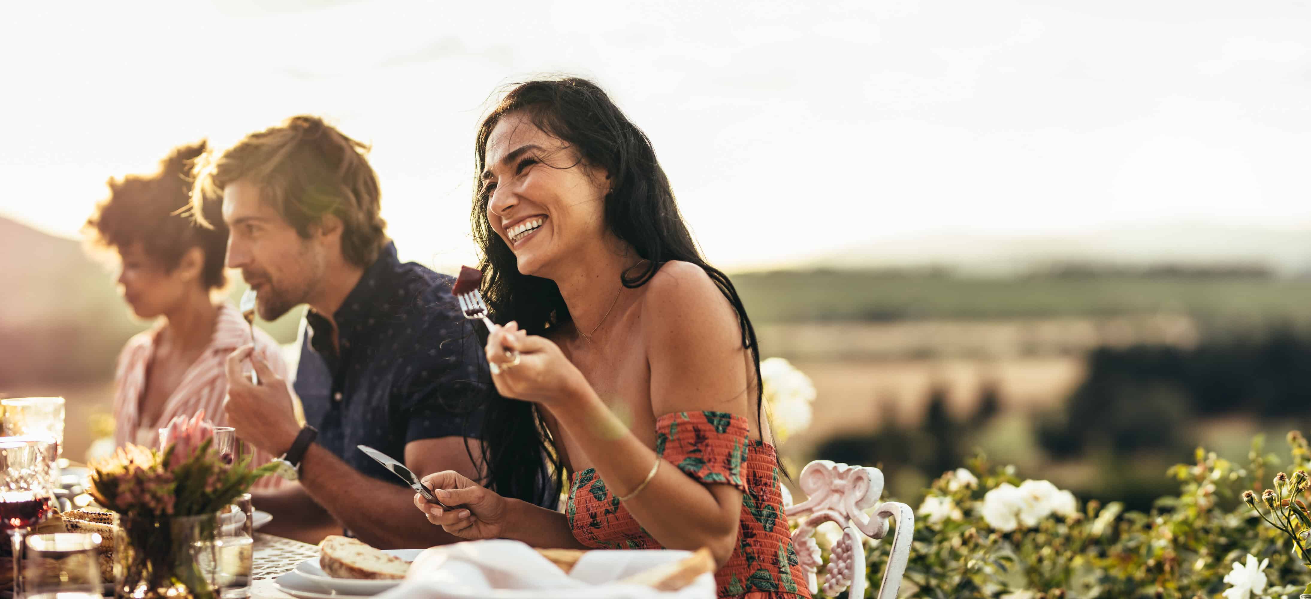 woman-with-friends-having-meal