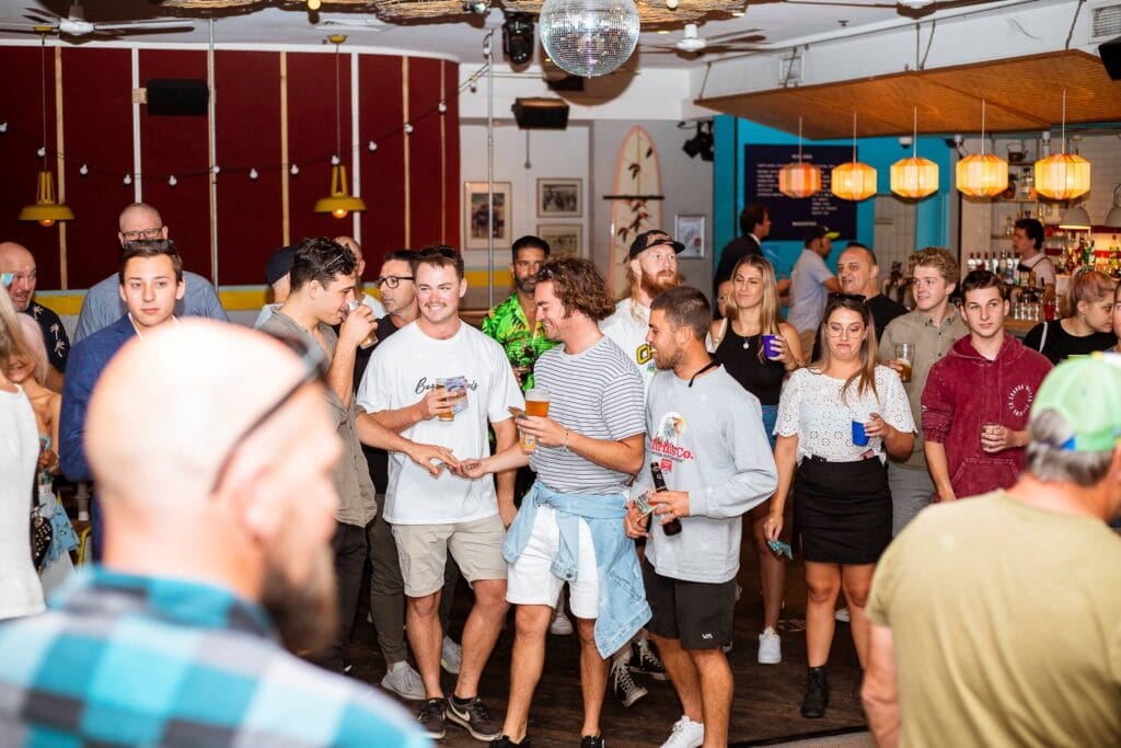 A crowd gathers to play two-up at Northies in Cronulla on Anzac Day