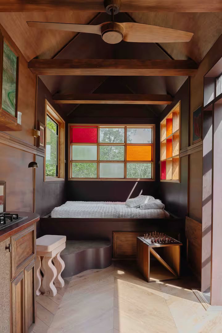 Ritual Lodge interior coloured glass windows timber cabin Tapitallee NSW accommodation