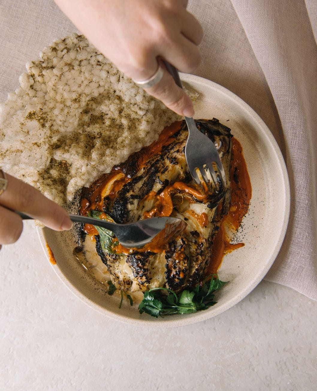 Charred cabbage with romesco sauce and rice cracker at Nour Surry Hills Sydney
