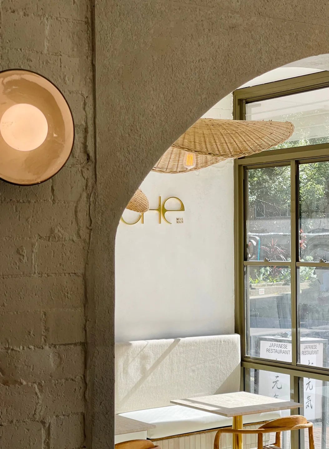 Arched interior with rattan pendant light at Niche Mosman Sydney