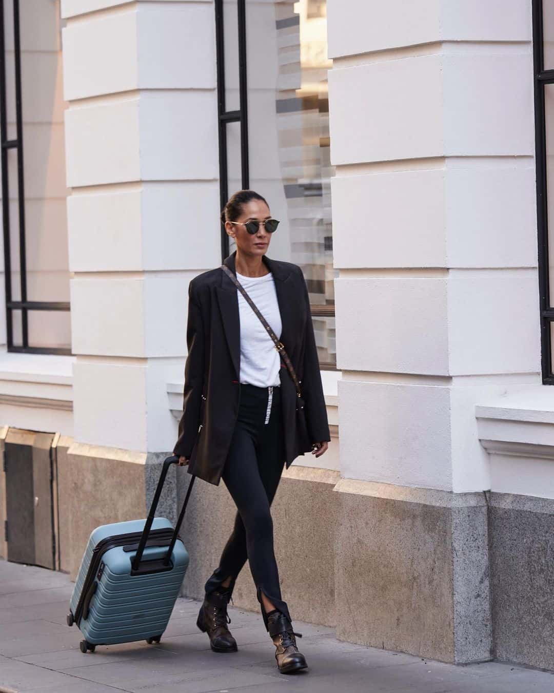 Lindy swears by a classic yet chic travel uniform. (Image Credit: @lindyklim/Instagram)