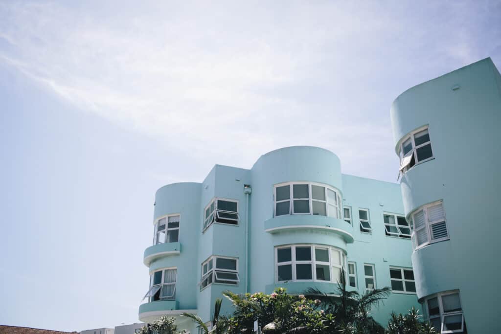 An art-deco style blue apartment building in Bondi.