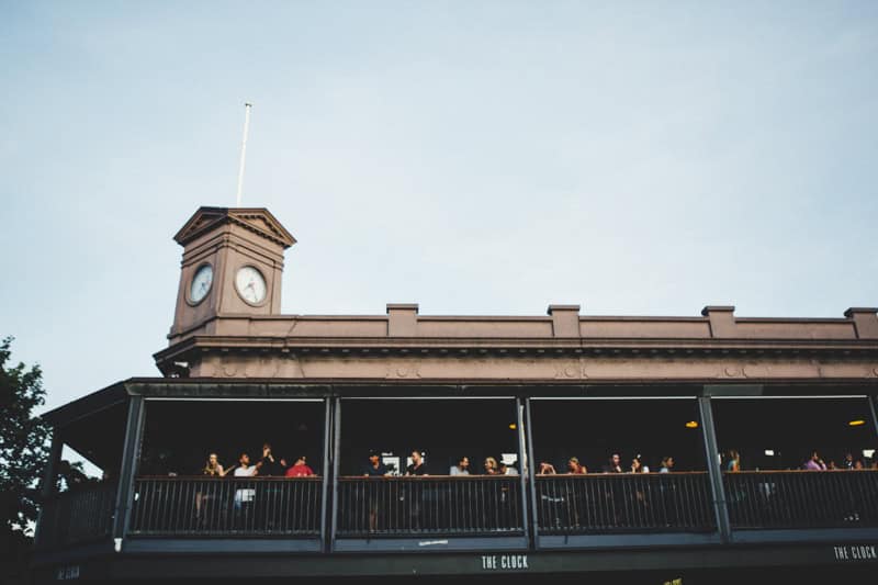 Punters sit on the verandah of the Clock bar in Surry Hills.