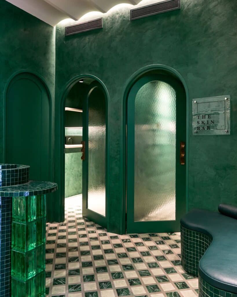 Green walls and chequered floors in the Skin Bar.