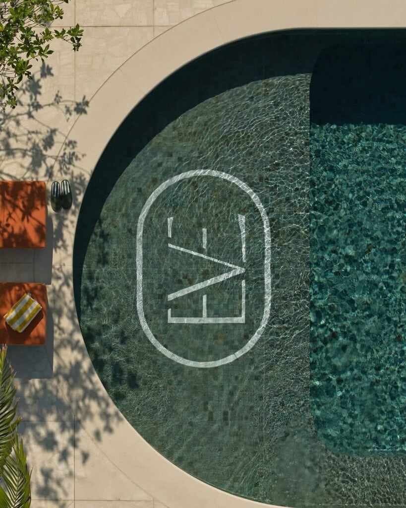 The rooftop pool with the word EVE written across it.