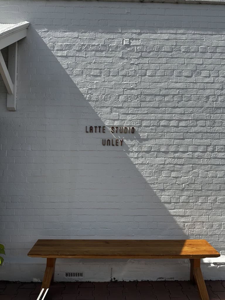 exterior of latte studio unley exposed white brick