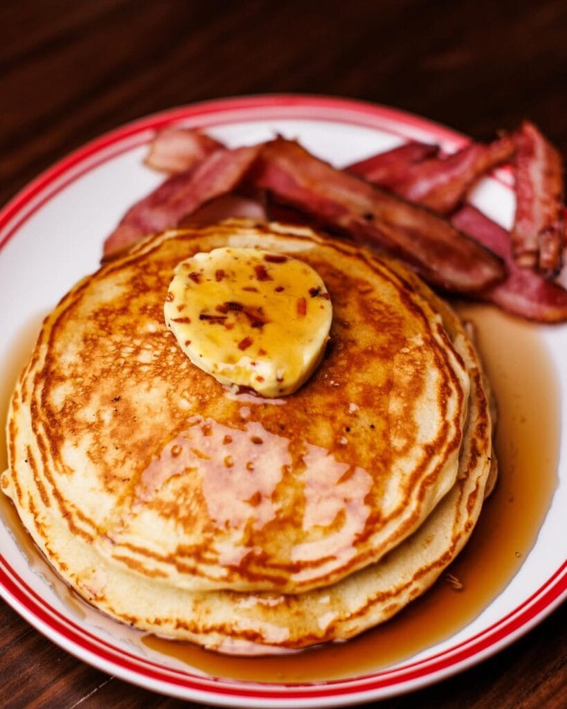 jollygood diner and bar buttermilk pancakes with butter and maple syrup and crispy bacon 