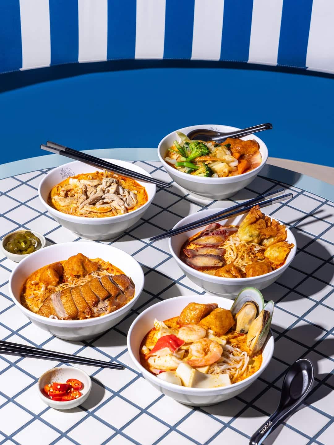 Selection of Malaysian laksa bowls with duck seafood and chicken at Into Laksa Sydney