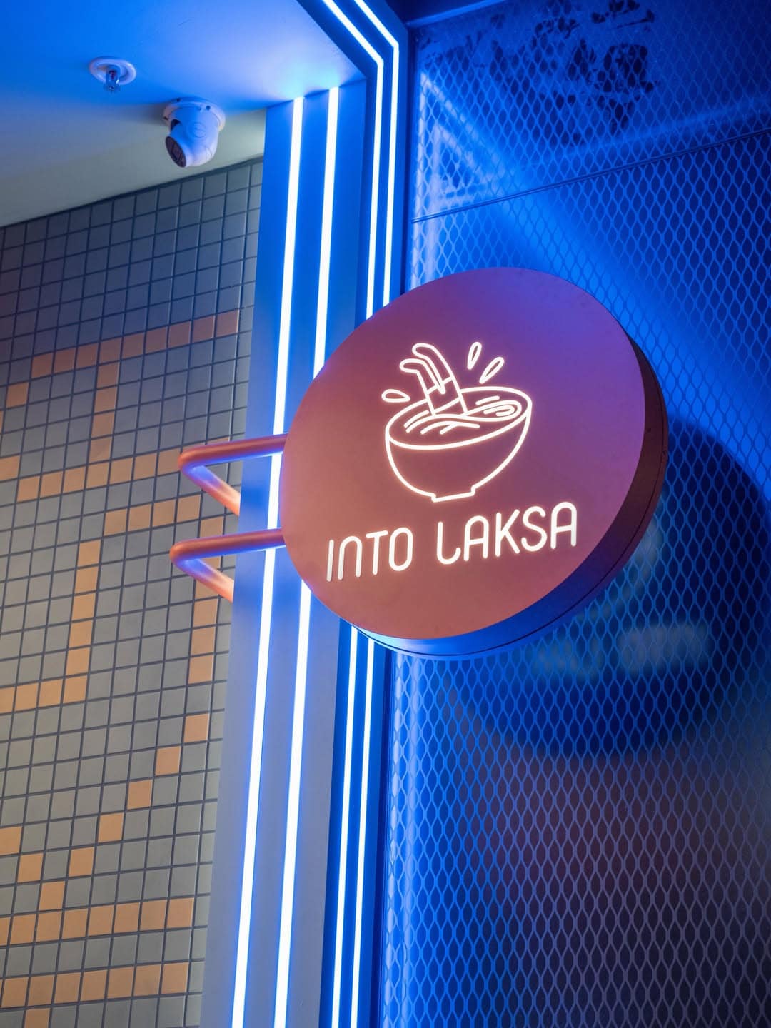 Into Laksa neon sign with blue light exterior at Sydney location
