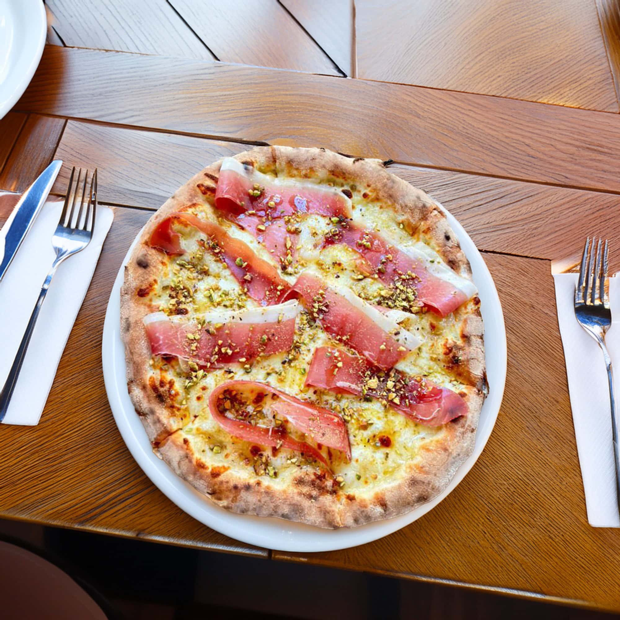 prosciutto and pistachio pizza at bella alice alice springs