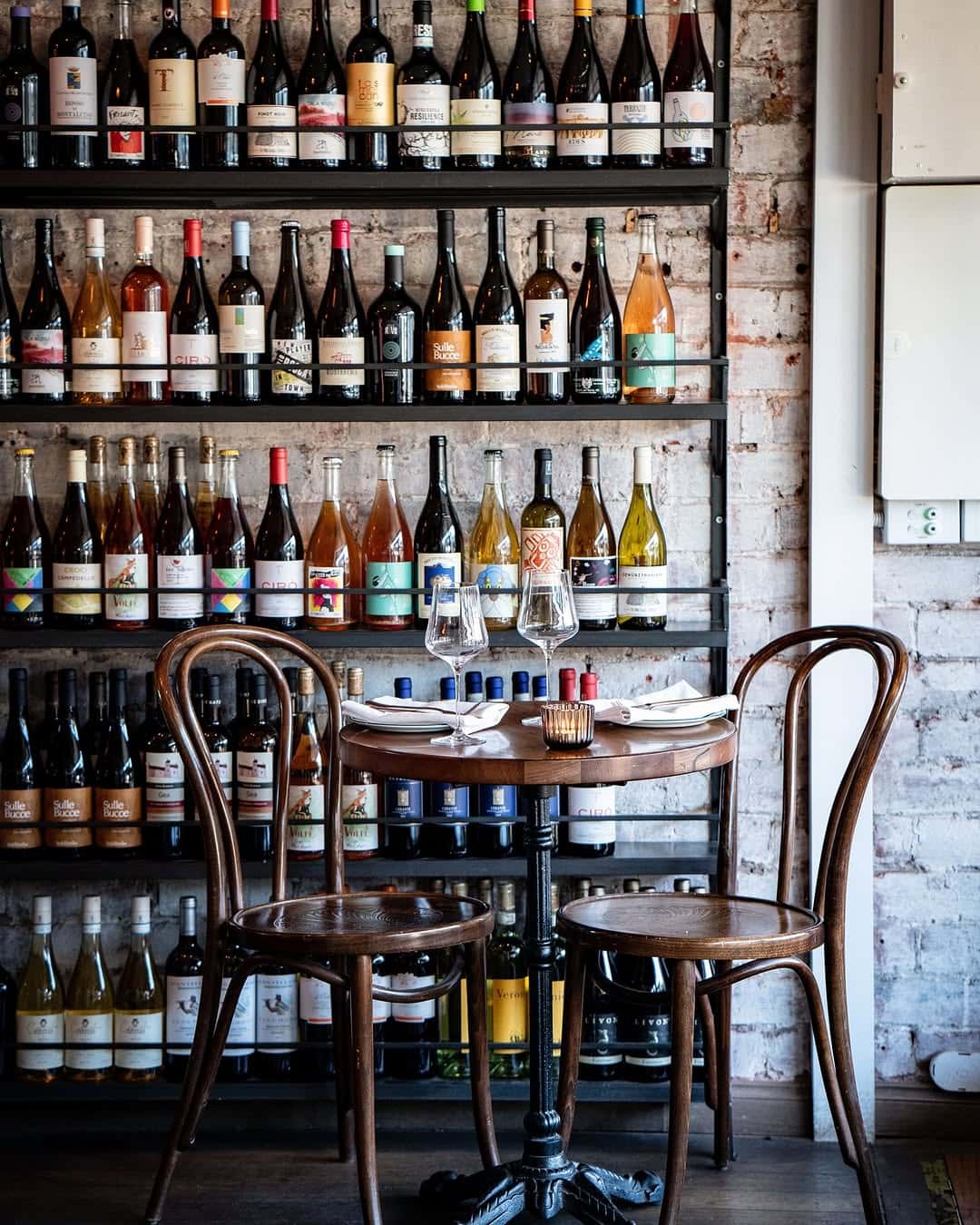 Wine wall and table at Officina Gastronomica Italiana