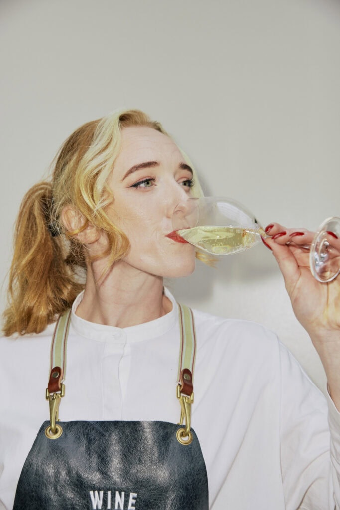 Dan Murphy's Best in Glass Awards Wine Merchant tasting a glass of white wine