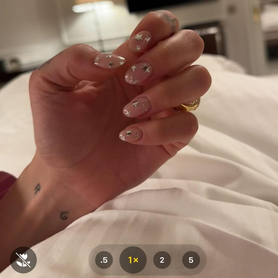 closeup of dua lipa's star patterned nails