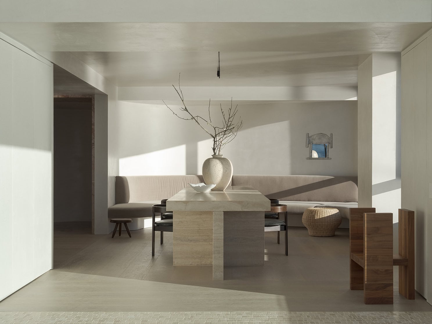 A modern dining room with a wooden table and chairs