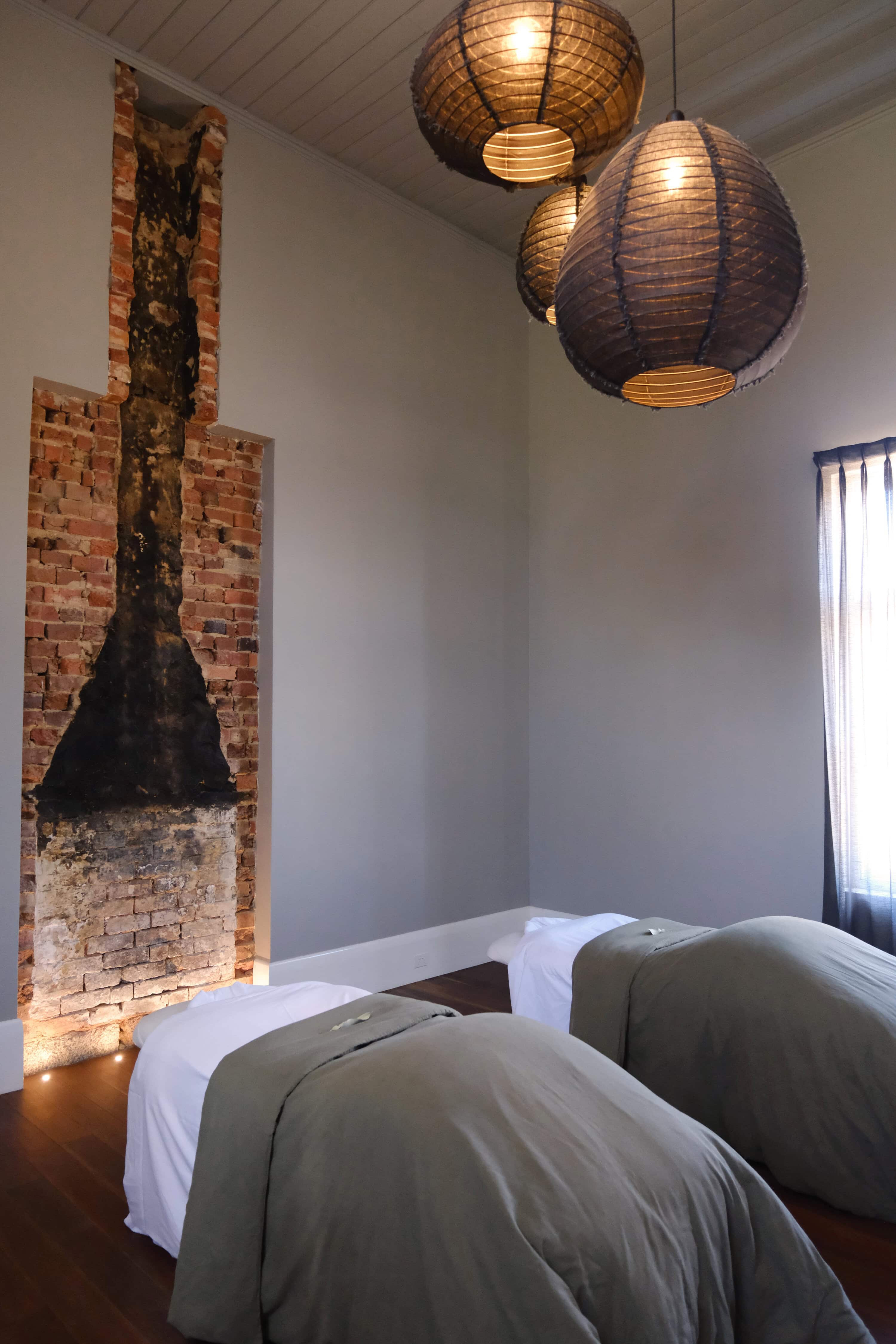 Luxury massages at The Benev in Beechworth with stone bath and fireplace for a High Country babymoon in Victoria.
