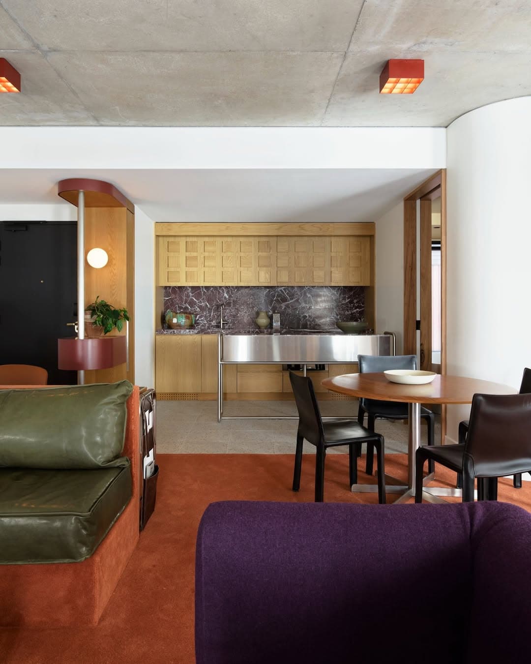 The mid-century styled living room at one of Ace Hotel's suites in Sydney.