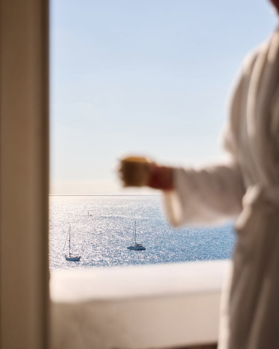 Morning coffee overlooking sparkling Port Phillip Bay and sailing boats from a guest room at Hotel Sorrento, Mornington Peninsula.