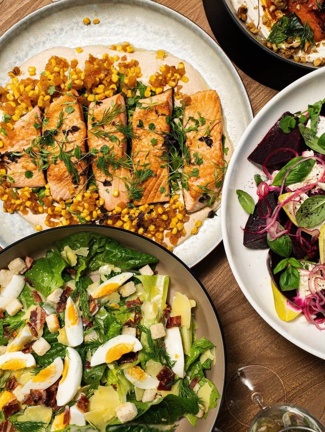 Shared plates of salmon with corn caesar salad and beetroot salad Catered by Matt Sydney