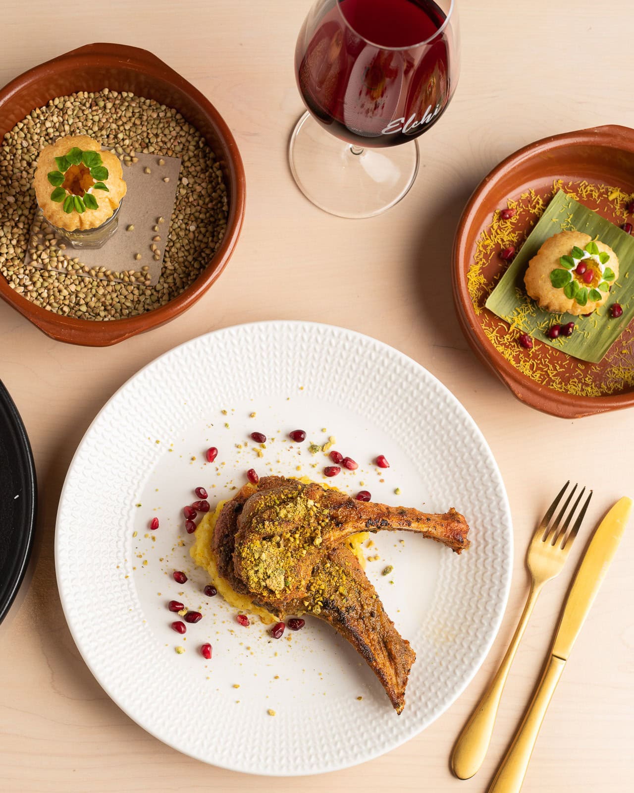 Modern Indian dishes at Elchi in Melbourne, with curries, tandoor plates, naan and shared dishes across the table.