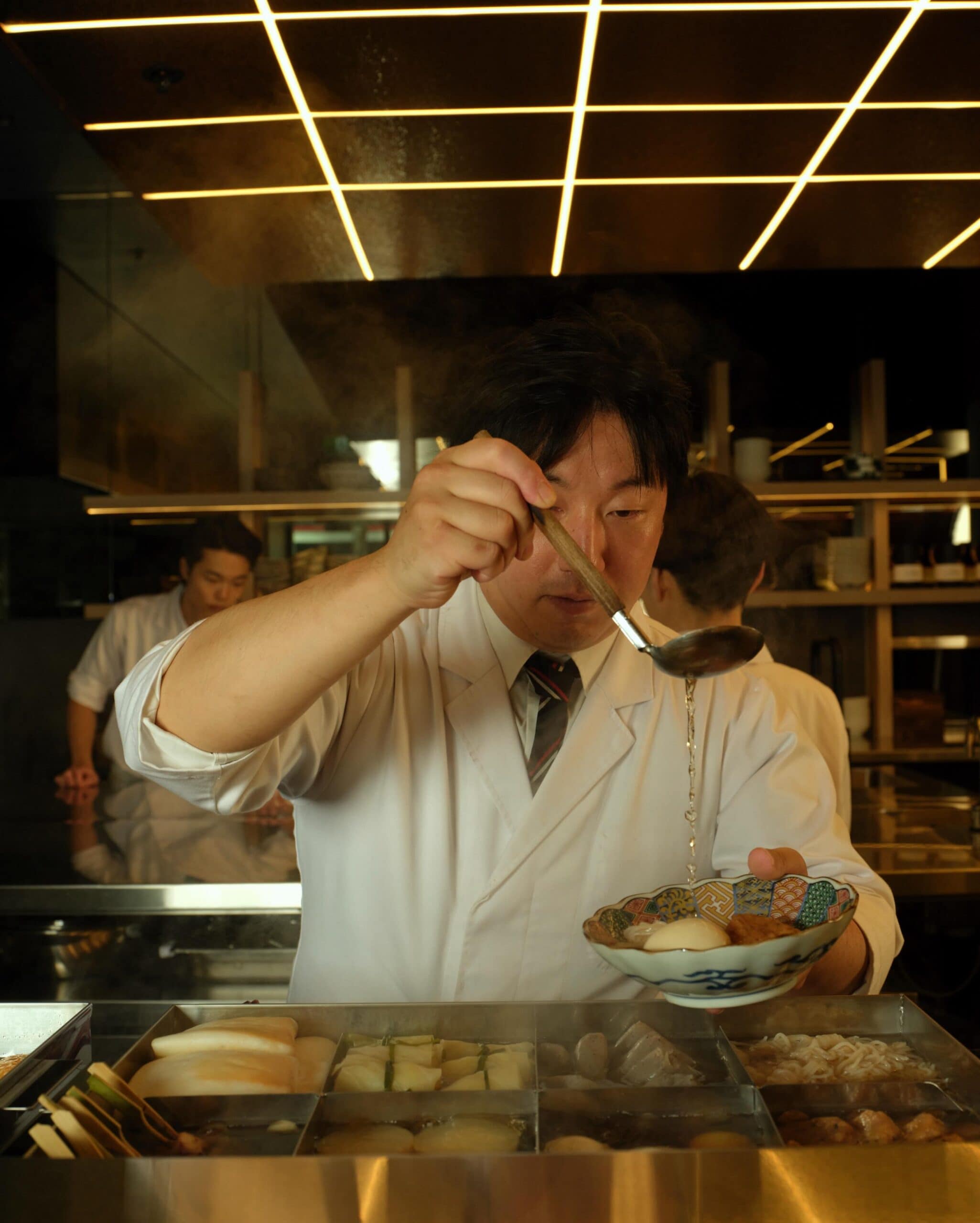 chef serving up a bowl at oden melbourne