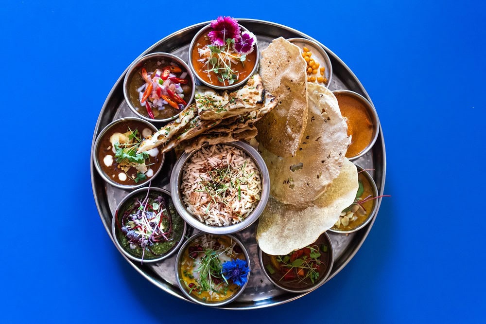 Grand feast platter with curries rice and papadums at Don't Tell Aunty Surry Hills Sydney