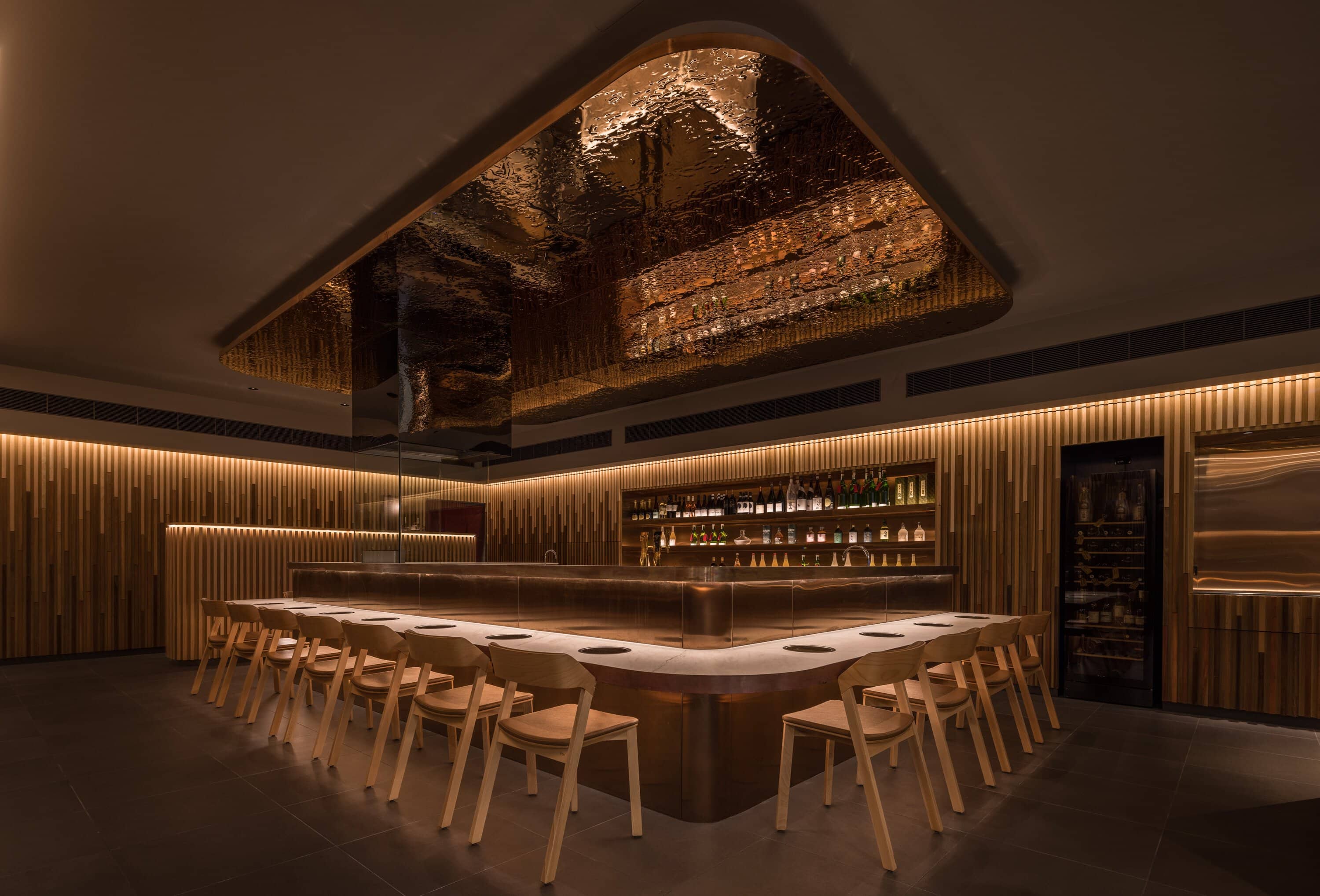 Hanasuki restaurant interior with built-in cooktop counter and wood paneling Chatswood Sydney