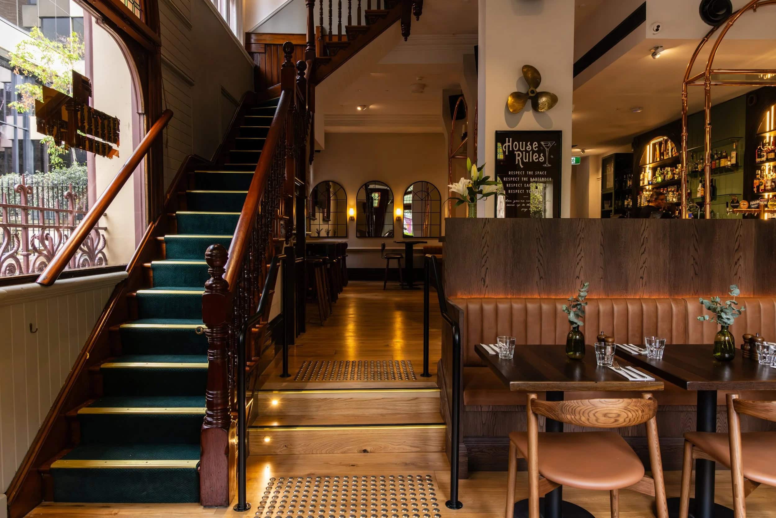 Timber staircase and dining booths inside Fortune of War The Rocks Sydney