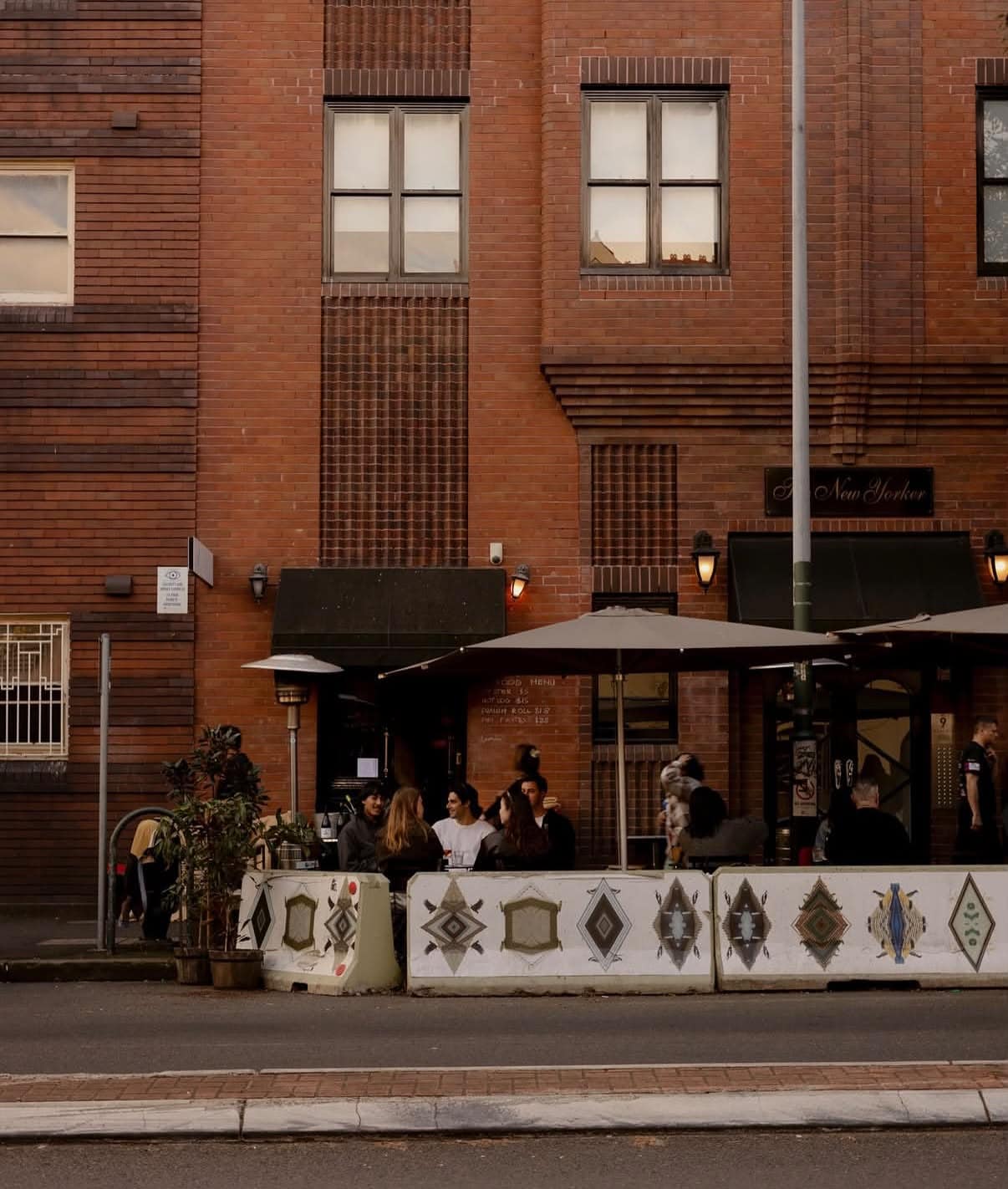 Outdoor tables in evening light at Caravin Potts Point Sydney