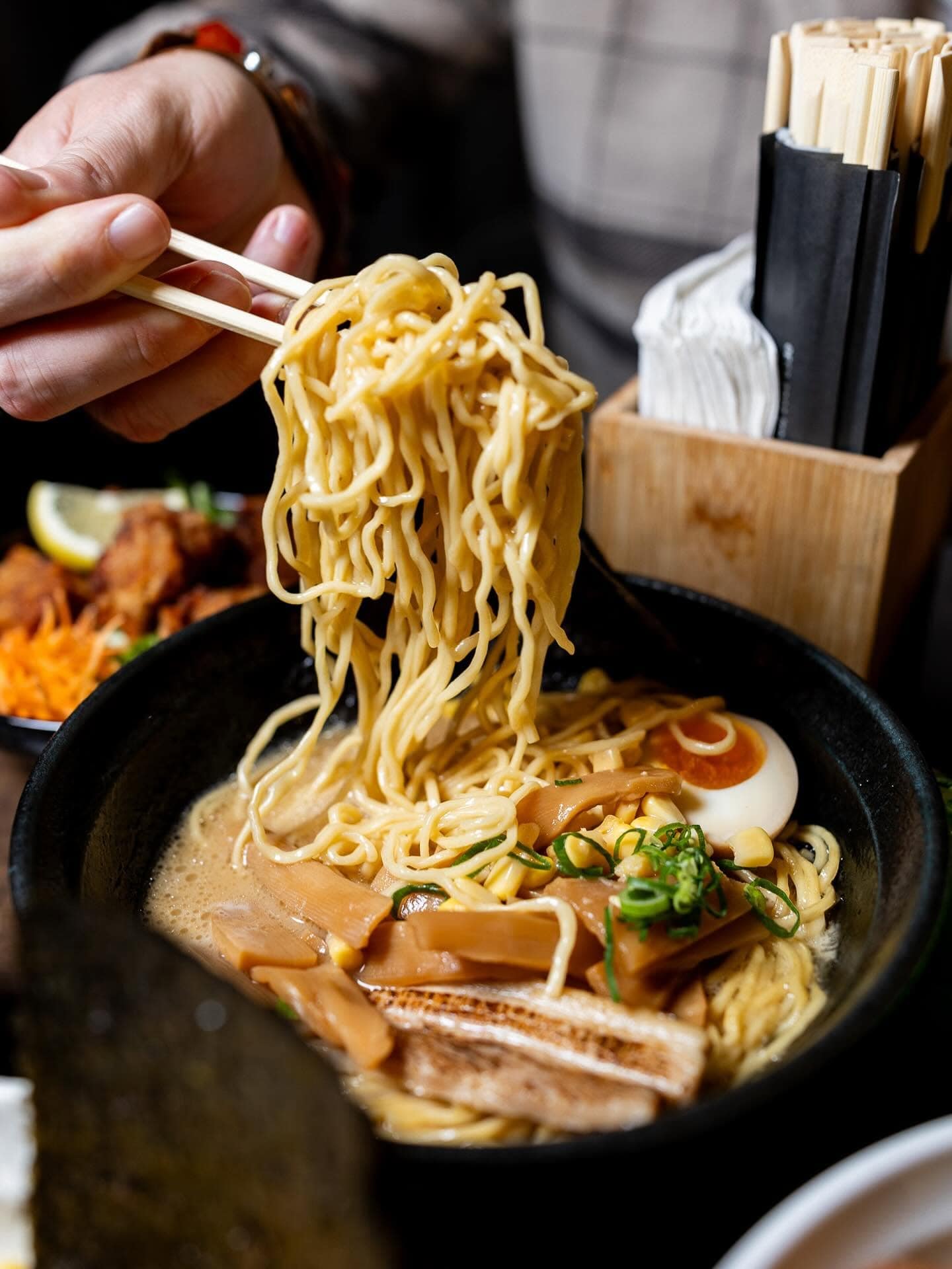 bowl of ramen noodles and broth at shyun ramen bar carnegie