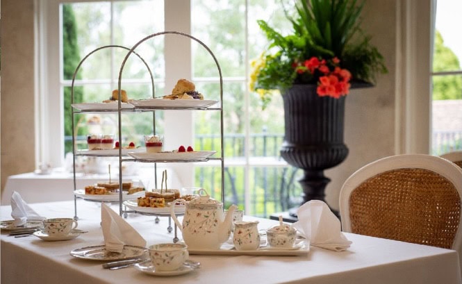 Villa Howden high tea with tiered pastries, fine china and garden views near Hobart.