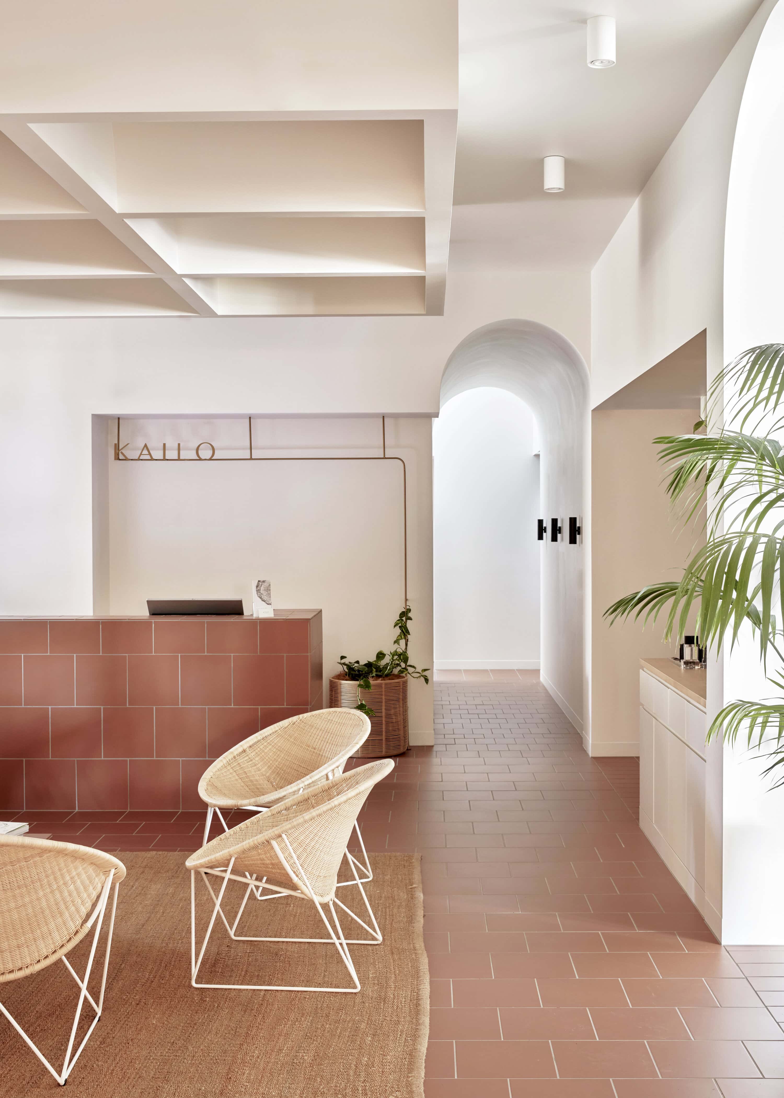 The terracota hued waiting room of a luxurious day spa