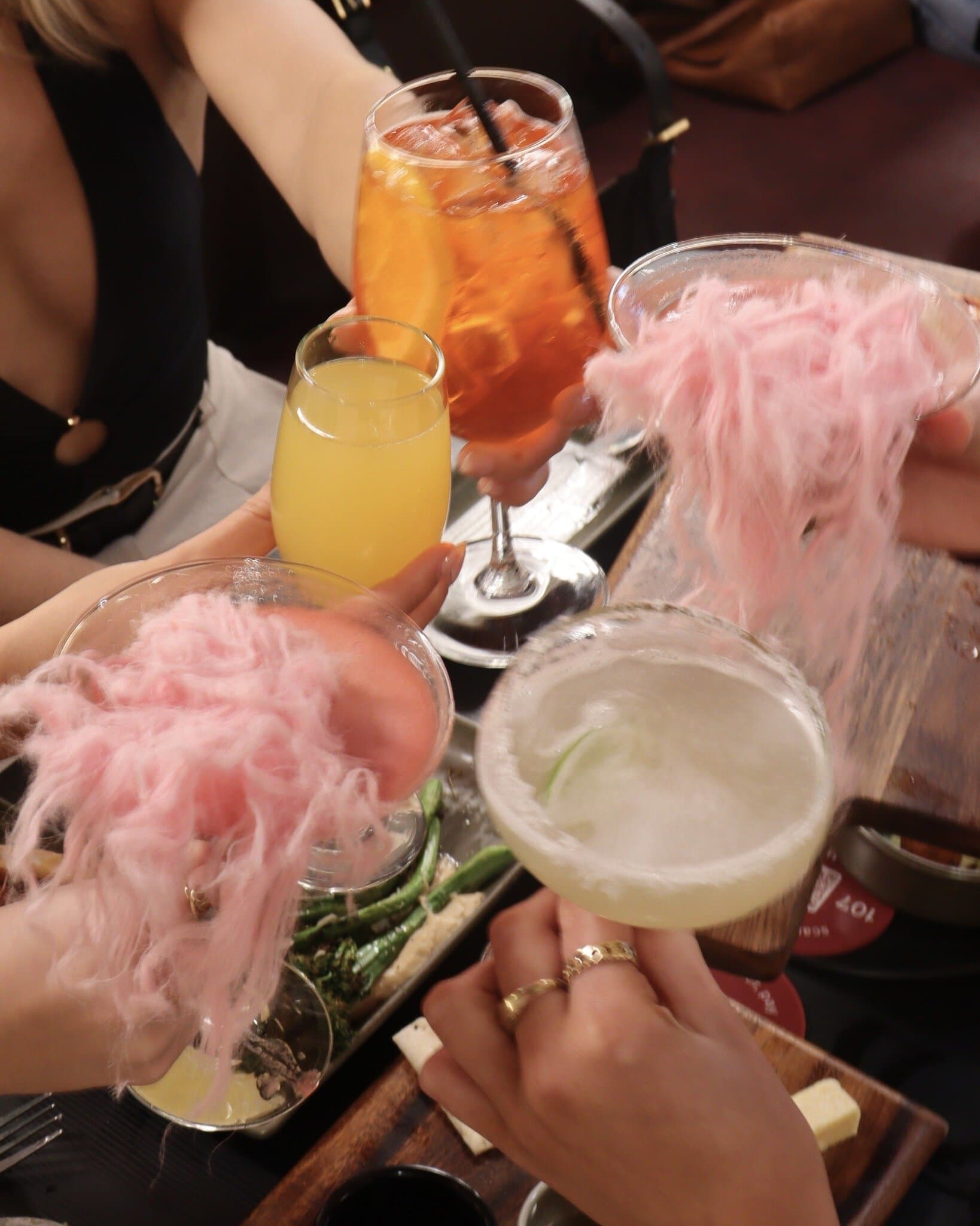 Cocktails with pink cotton candy garnish at Li'l Darlin Crows Nest Sydney