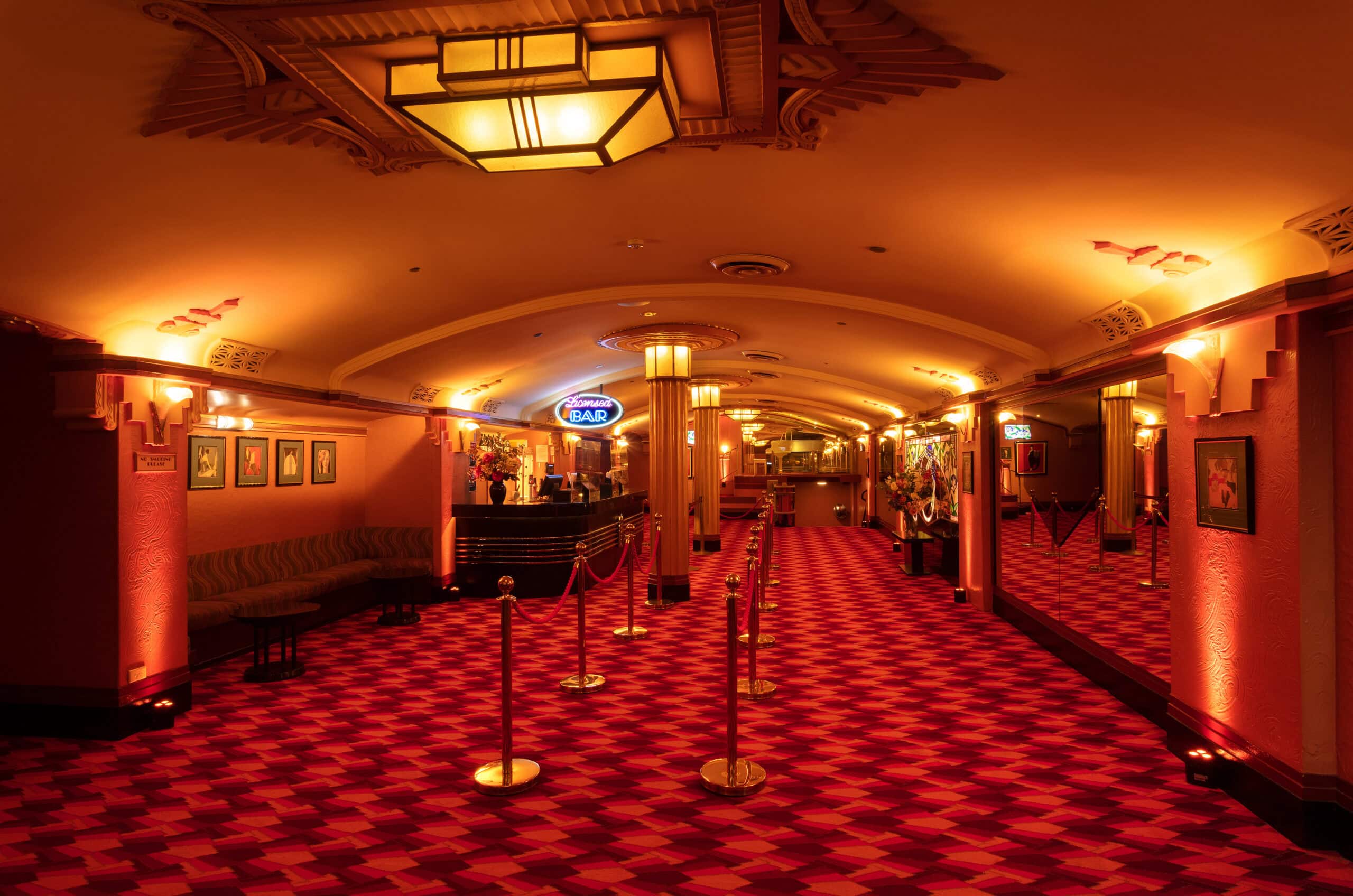 Art deco foyer with red patterned carpet at Hayden Orpheum Cremorne Sydney