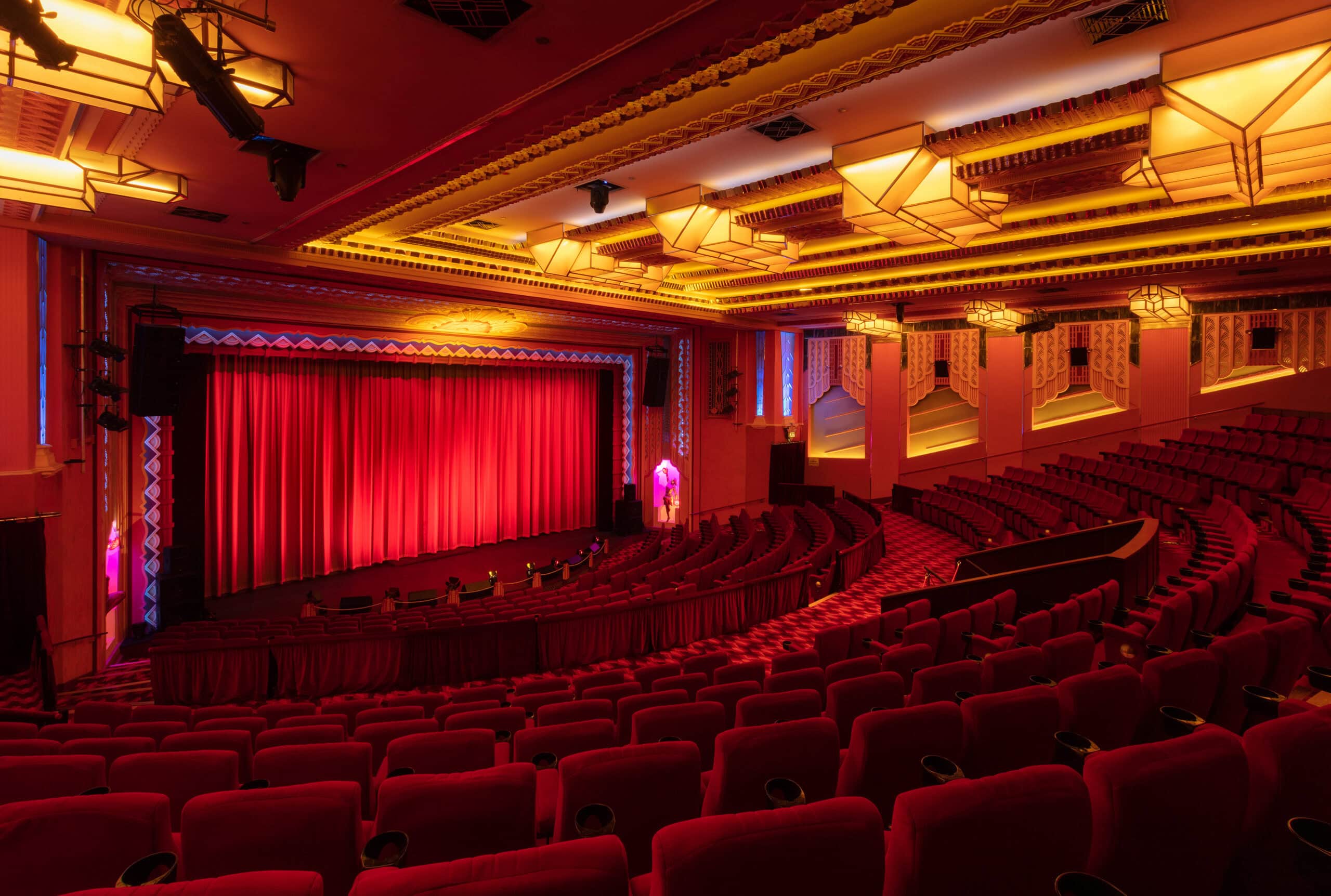 Main cinema hall with red velvet seating and red stage curtain at Hayden Orpheum Cremorne Sydney