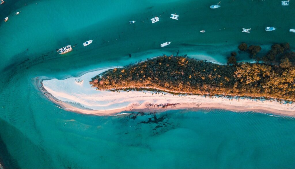 An aerial shot of the white sands of Hyams Beach in Jervis Bay.
