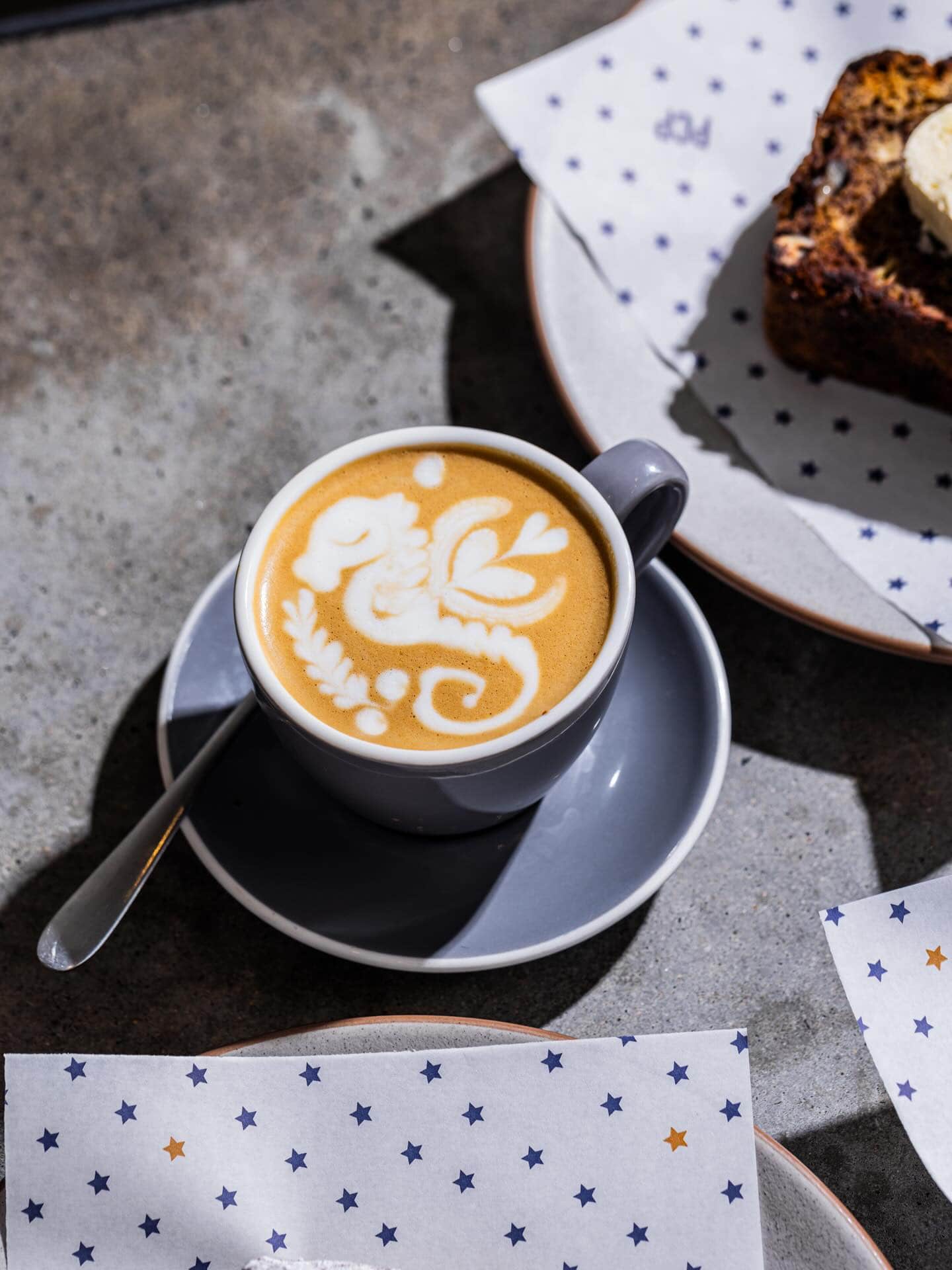 A coffee with elaborate latte art at Paramount Coffee Project in Surry Hills.