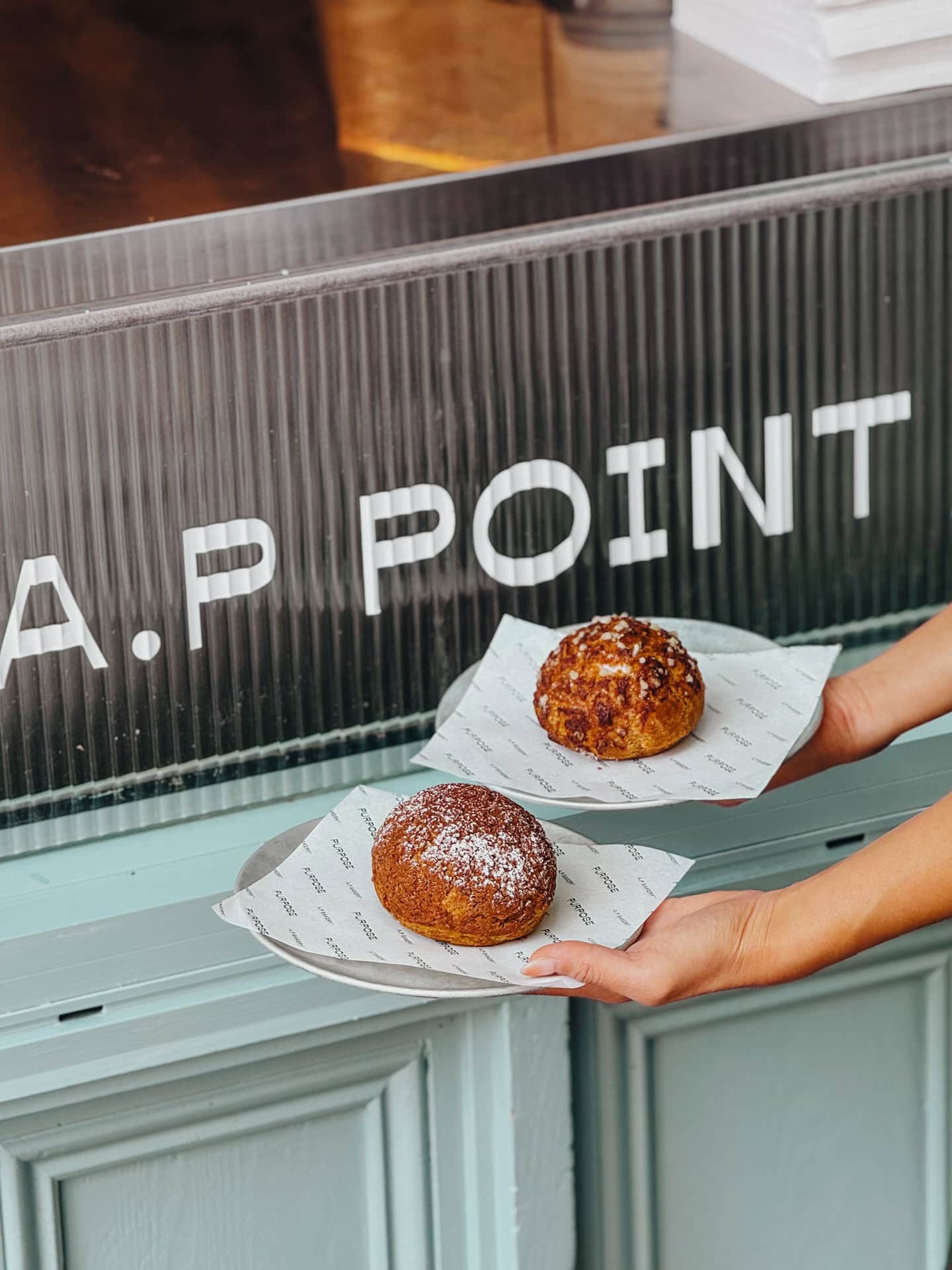 Cream puffs on plates at AP Point Potts Point Sydney